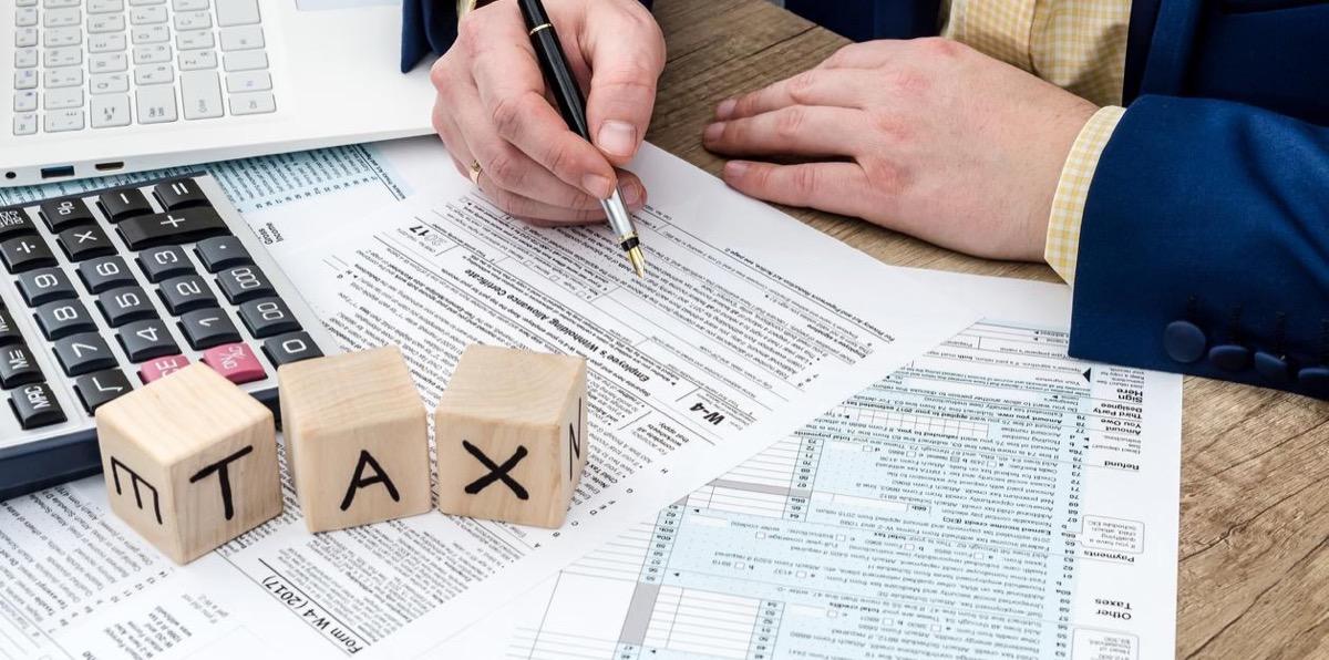 Tax professional working on W-4 forms